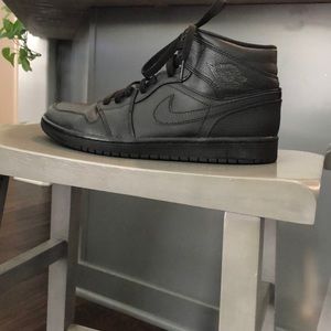 A pair of black Air Jordan’s 1, size 10, smoke free home, worn once